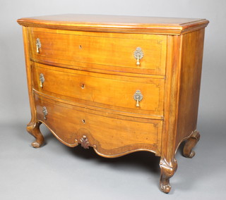 A Continental walnut bow front chest with moulded top fitted 3 long drawers with brass drop handles, raised on cabriole supports 38 1/2"h x 45"w x 23 1/2"d 