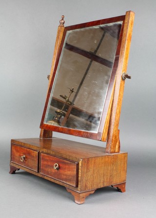 A 19th Century rectangular plate dressing table mirror contained in a mahogany swing frame, the base fitted 2 short drawers raised on bracket feet 21"h x 14"w x 7"d 