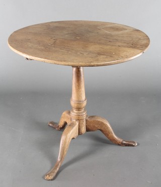 An 18th/19th Century bleached oak circular tea table raised on a pillar and tripod base 25"h x 27" diam. 