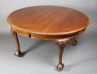 An Edwardian Chippendale style oval extending dining table with gadrooned border, raised on cabriole supports together with 2 extra leaves 29"h x 47 1/2"w x 55" when closed by 87" when fully extending.  There is a winder to go with this table, which is being held in the office 