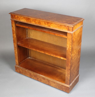 A burr walnut finished bookcase with moulded top, fitted adjustable shelves, 38"h x 38"w x 12 1/2"d 