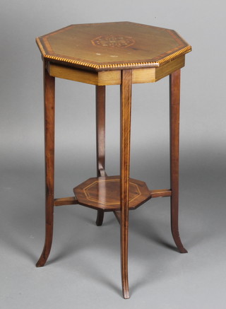 An Edwardian octagonal inlaid mahogany 2 tier occasional table with crossbanded and inlaid top with centre inlaid a floral motif, raised on square tapering supports 17"h x 17" 