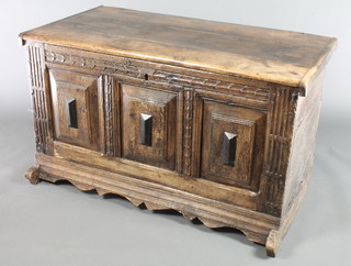 An 18th/19th Century Continental carved oak coffer of panelled construction with hinged lid 28"h x 47 1/2"w x 25"d 