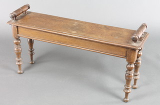 A Victorian rectangular oak hall bench with scroll arms, raised on turned supports 18"h x 36"w x 10"d 