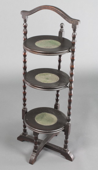 A 1930's circular oak cake stand with bobbin turned decoration and X framed stretcher 34"h x 12"w x 11"d  