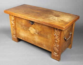A Continental carved oak coffer of panelled construction with iron drop handles 26 1/2"h x 49"w x 21 1/2"d 