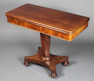 A William IV mahogany tea table, raised on chamfered column with triform base, bun feet 28"h x 35"w x 17 1/2"d 