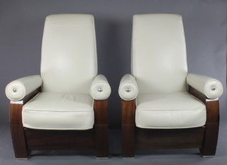 A pair of Art Deco style walnut finished armchairs upholstered in white hide