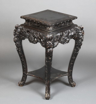 A square Chinese ebonised 2 tier jardiniere stand, raised on carved supports with pierced apron 30"h x 15"w x 15 1/2"d 
