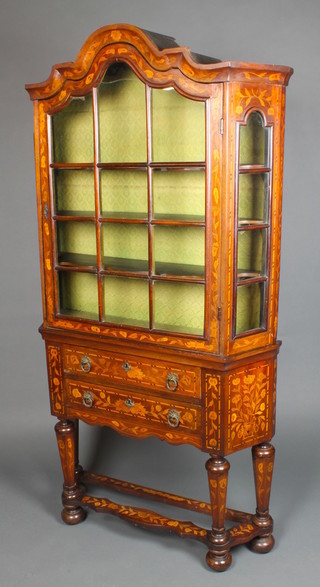 A Dutch 18th/19th Century side cabinet, the upper section with shaped top and 2 long drawers, raised on 4 octagonal tapered supports with shaped stretcher and bun feet 66"h x 34"w x 9"d  