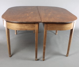 A 19th century mahogany dining table with 2 extra leaves, raised on 8 square tapered supports, spade feet 30"h x 51 1/2"w x 54 1/2" x 88" with the leaves 