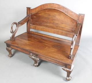 A 19th Century mahogany hall bench with arched raised back and out swept arms with carved swan decoration, raised on cabriole ball and claw supports 36"h x 46"w x 23"d (made up)