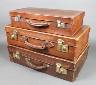 A Reane's leather suitcase with brass locks 6 1/2"h x 24"w x 15"d (the base has been restitched and is loose), 1 other brown leather suitcase with brass mounts 6" x 24"w x 14"d  and 1 other brown case with chrome mounts 5" x 20" x 11", all cases have some scuffing