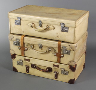 A parchment suitcase with chrome locks 9" x 30" x 17", 2 parchment cases with chrome locks and leather straps 9" x 30" x 18"

