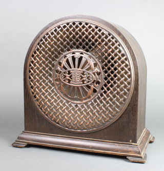 A 1920's Radiolux Amplion radio speaker, contained in an arched oak case on ogee bracket feet 16"h x 16 1/2"w x 9"d 