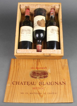 Three bottles of 1981 Chateau Blaignan Medoc contained in a crate 