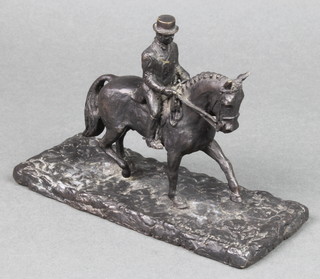 Edwin Johnson, a bronze figure of a dressage rider raised on a rectangular base 4"h x 6 1/2"w x 3"d 