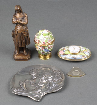 A spelter figure of a standing Joan of Arc, the base marked DSR 5", an Art Nouveau style pin tray decorated a portrait of a lady with angels marked 225 4", an enamelled trinket box in the form of an  Easter egg dated 1978 2", a Halcyon days oval enamelled table clock (f) 3" 