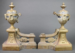 A pair of 19th Century French pierced metal andirons in the form of urns 15" x 11" (missing central grill) 