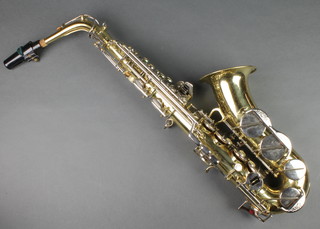 A Corton brass saxophone in a carrying case