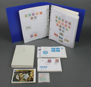 A collection of Swiss stamps 1850-1980 including Pro-Juventute issues, first day covers contained in a blue album and a small shoe box 