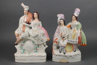 A Staffordshire group of a lady, gentleman and dog 13", a ditto of a Scottish lady and gentleman 13"