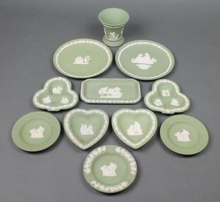 A Wedgwood green Jasperware flared neck vase 3 1/2", 8 ditto dishes and 2 small plates 