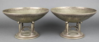 A pair of stylish silver plated Art Nouveau hammer pattern bowls on quatrefoil supports and circular bases 9 1/2"