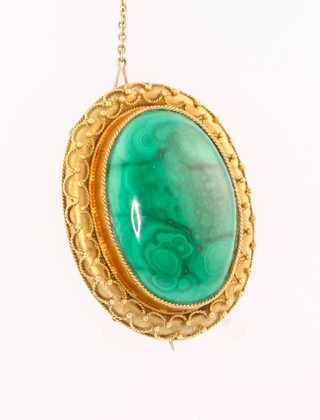 A Victorian high carat etruscan style oval malachite brooch 1 3/4" x 1 1/4" 
