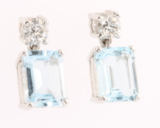 A pair of 18ct white gold aquamarine and diamond drop earrings, the rectangular cut stones approx 1.5ct each supported by brilliant cut diamond 0.2ct each  