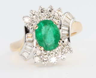 An 18ct yellow gold fancy emerald and diamond ring, the centre stone approx 1.5ct, surrounded by tapered baguette and brilliant cut diamonds 1.0ct, size N, together with certificate 