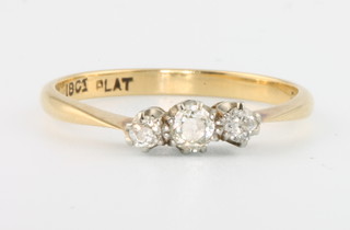 An 18ct yellow gold 3 stone diamond ring size M 1/2 