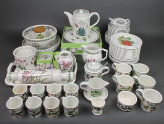 A quantity of Portmeirion Botanic Garden pattern tableware comprising 8 coffee cups, 4 saucers, 5 tea cups, 9 saucers, a coffee pot, milk jug, cream jug, a sugar bowl with lid, 6 small plates, 14 medium plates, a boxed cake stand, a bowl, a tea bag dish, a small dish, a lidded jar, a salad bowl, a quiche dish, a tray, 2 pots, 2 lidded boxes, a vase, an egg cup and a rolling pin 