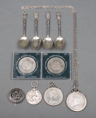 Four Continental teaspoons with fancy handles, minor crowns and coins 