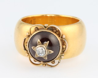 A 22ct yellow gold late Victorian ring with cabochon cut garnet and diamond, size S