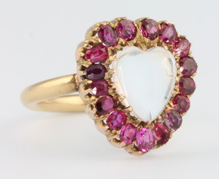 A yellow gold moonstone and ruby heart shaped ring size P