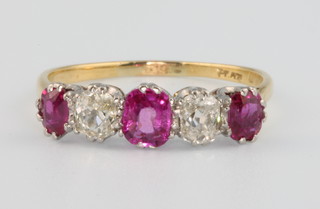 An 18ct yellow gold ruby and diamond ring, size N
