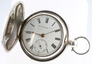 An Edwardian silver hunter pocket watch with engine turned case and seconds at 6 o'clock, the dial inscribed Stewart Dawson & Co Liverpool