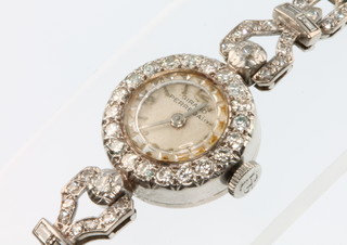 A lady's 18ct white gold and diamond Girard Perregaux cocktail watch