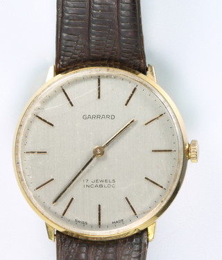 A gentleman's gilt cased Garrard wristwatch on a leather strap 