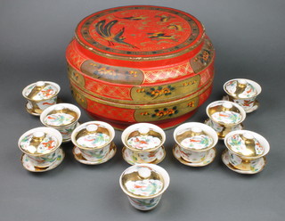 An early 20th Century Chinese painted circular box decorated with exotic birds and flowers 14", a quantity of modern gilt decorated tea bowls and lids