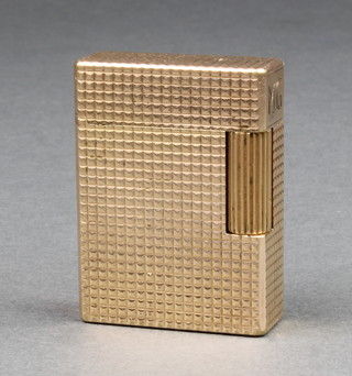 A gold plated Dupont lady's petrol cigarette lighter with bright cut decoration 