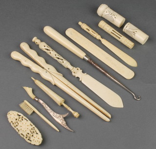 A pair of bone glove stretchers, minor bone and ivory items including sewing implements 