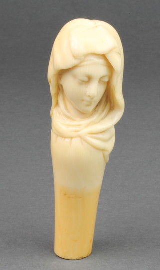 A 19th Century carved ivory Dieppe parasol handle in the form of a lady wearing a shawl 1 1/2" 
