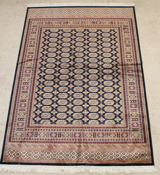 A contemporary blue ground Bokhara style Belgian cotton carpet 59" x 64" 