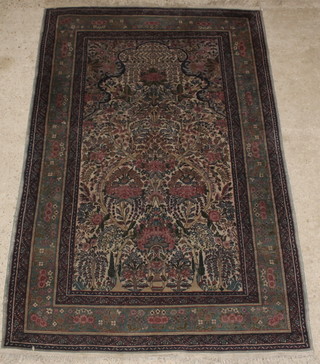 A fine quality Persian rug with shaped mihrab and floral ground within multi-row borders 93" x 55" 