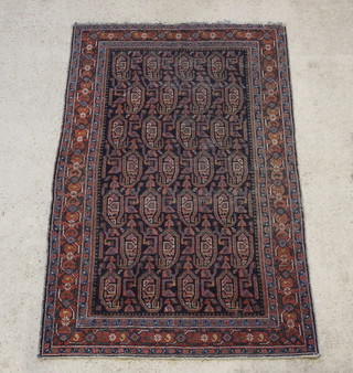 An Antique Persian Malayer blue ground rug with all-over hooked design 79" x 52" 