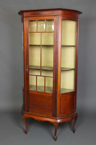 A Victorian mahogany bow front display cabinet moulded cabinet, fitted shelves enclosed by an astragal glazed panelled door, raised on cabriole supports 56 1/2"h x 36"w x 15 1/2"d 