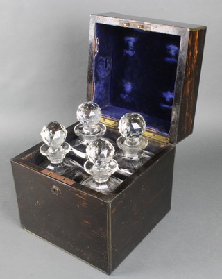 A Victorian Coromandel and brass mounted decanter box with bramah lock, fitted 4 cut glass decanters 10"h x 9 1/2" x 9 1/2"