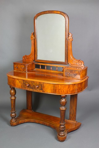 A Victorian walnut Duchess style dressing table with oval plate mirror above 2 glove drawers, the base fitted a drawer with tore handles, raised on turned supports 58 1/2"h x 41"w x 20 1/2"d 